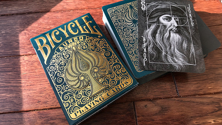 Bicycle Aureo Playing Cards on a desk available at 52kards.com