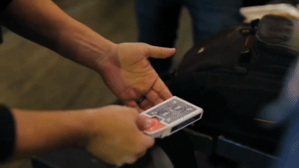 Performing 'Blue Illusion' by Yarden Aviv & Mark Mason – a stunning tuck box color change card trick available at 52Kards.