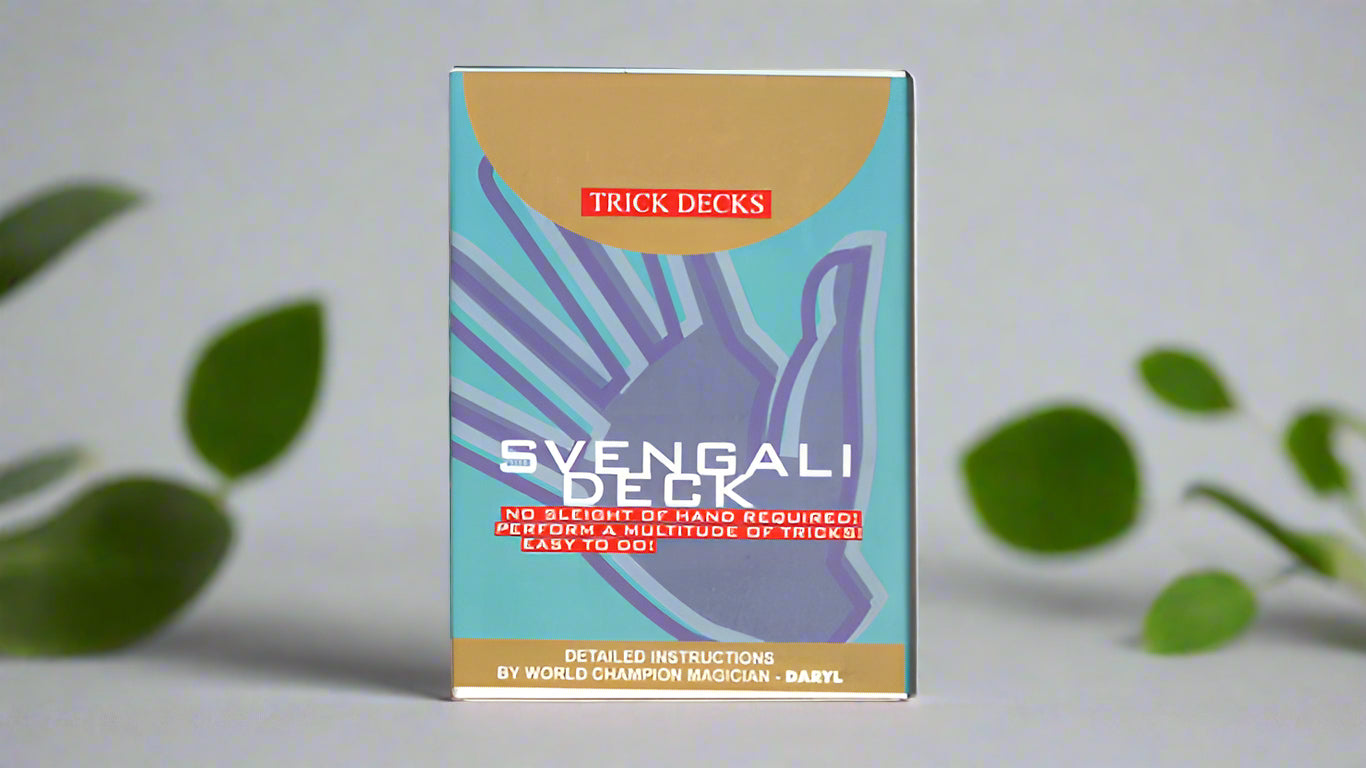 Product packaging for the 'Svengali Deck' trick deck. The box is teal with a purple hand graphic and white bold text. A red label highlights 'No sleight of hand required' and 'Perform a multitude of tricks!' with instructions by world champion magician Daryl. The top features a 'TRICK DECKS' label.