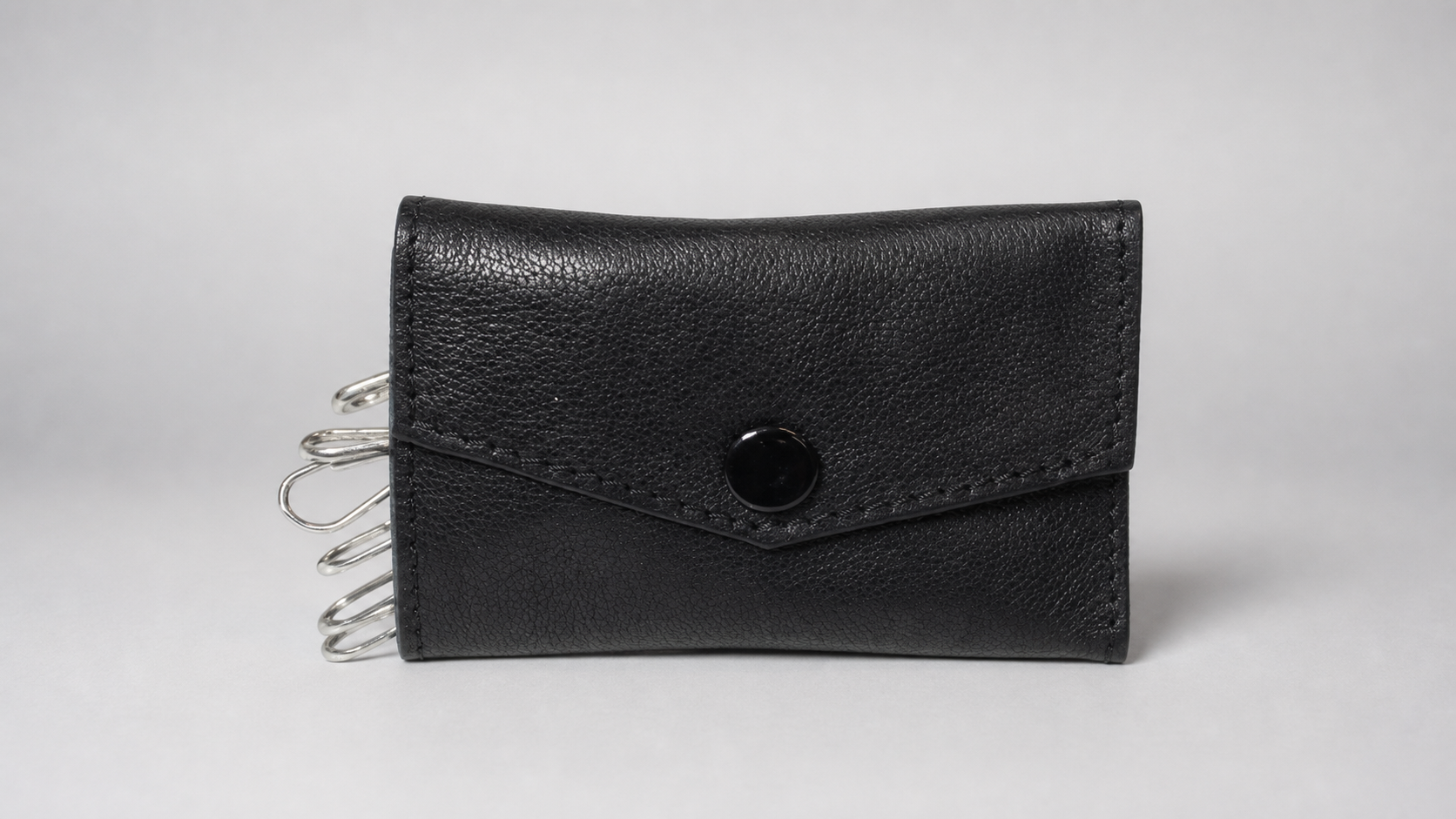 Ring Flite (Leather) by Premium Magic - Trick on a neutral studio background