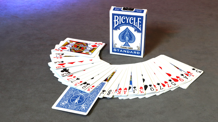 Blue Bicycle Invisible Deck spread face up with one face-down card and the tuck box standing behind it