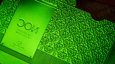 Green NOC Luxury tuck box beside its matching embossed sleeve