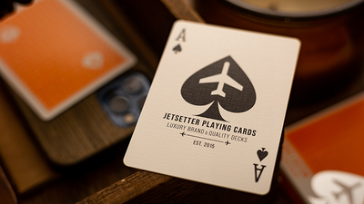 Jetsetter Lounge Ace of Spades above an orange tuck box