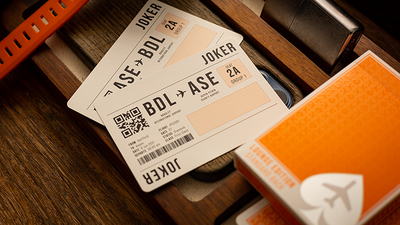 Two Jetsetter Lounge Jokers designed as boarding passes beside an orange tuck box