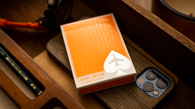 Orange Jetsetter Lounge tuck box beside a smartphone