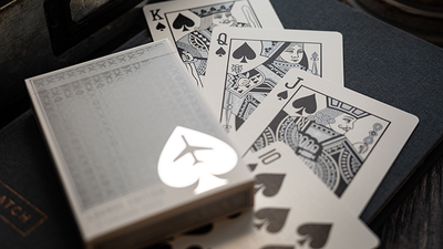 Jetsetter Lounge King, Queen, and Jack of Spades beside a silver tuck box
