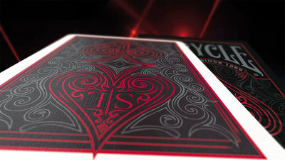 Close-up of a black-and-red Bicycle Shin Lim card back with the tuck box behind it