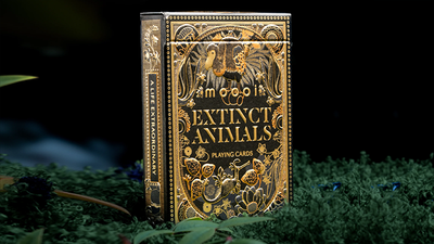 Front of the black-and-gold Moooi Extinct Animals tuck box standing in moss