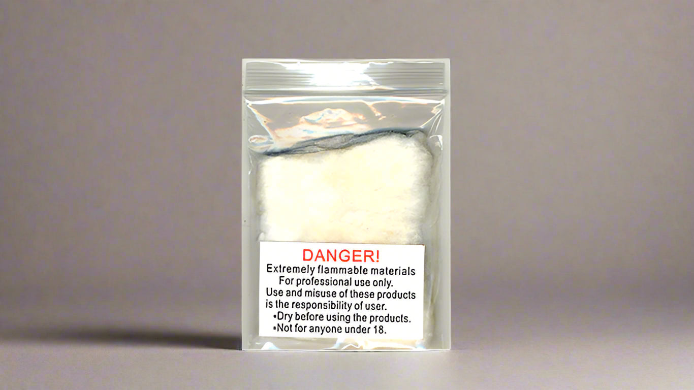 Flash Cotton in a clear resealable bag, labeled with a safety warning about its highly flammable nature. Designed for professional use in magic performances, the packaging includes instructions for proper handling and safety precautions.