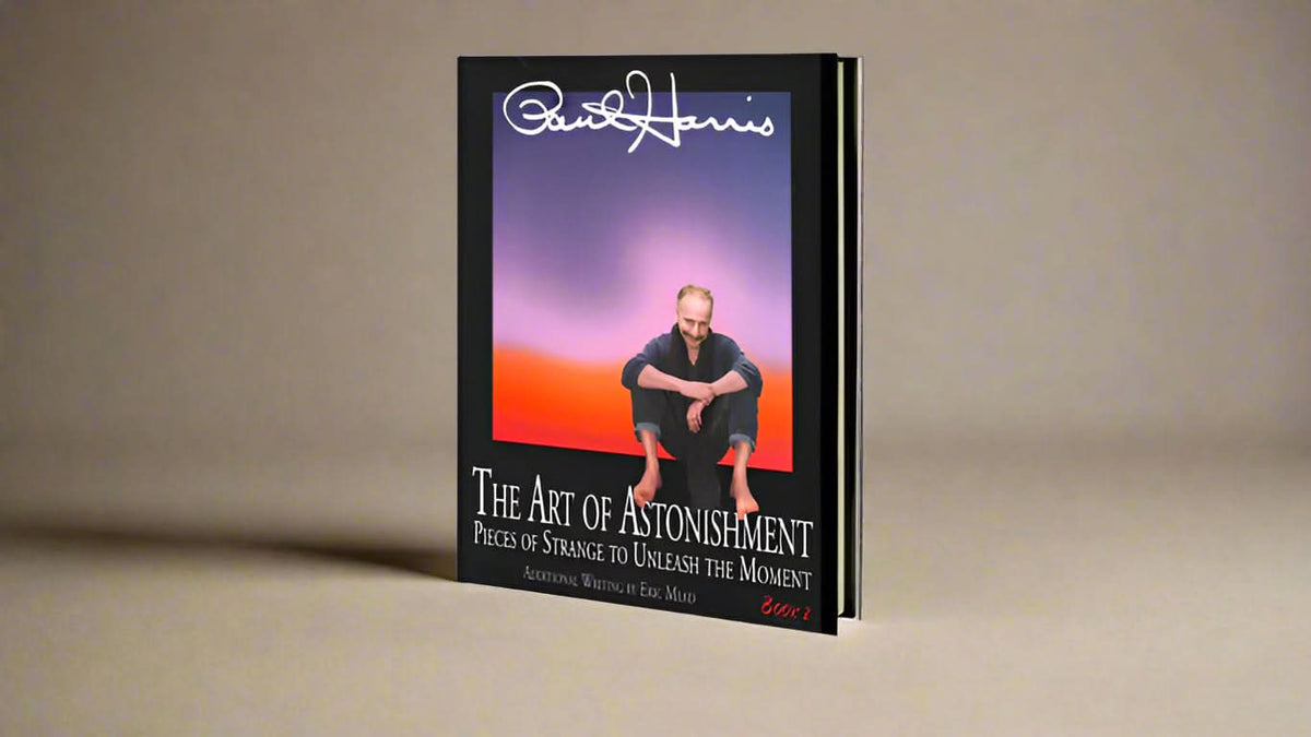 The Art of Astonishment book standing upright with Paul Harris pictured on the cover