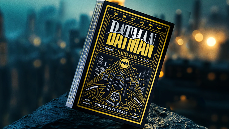 Picture showcasing the Batman 85th Anniversary Playing Cards by Theory11, featuring premium packaging with intricate gold and black artwork inspired by Gotham City. The design highlights the iconic bat emblem, celebrating eight decades of Batman’s legacy.