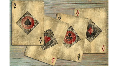 Four Bicycle Vintage aces overlapping on a wooden surface