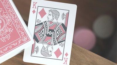 Black Roses Altrosa King of Diamonds beside a pink-backed deck