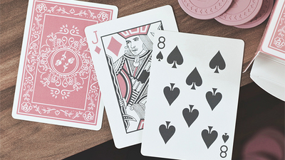 Black Roses Altrosa Jack and Eight of Spades beside a pink card back and open tuck box