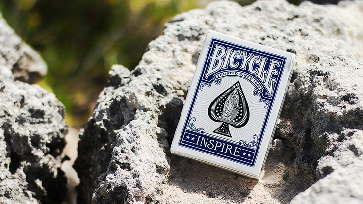Blue Bicycle Inspire tuck box standing upright on a rock