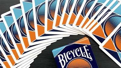 Bicycle Amplified card backs arranged in a wide fan around the tuck box