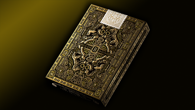 Back of the yellow Hufflepuff Harry Potter tuck box with ornate gold artwork and a white seal