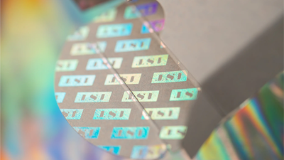 Close-up of the 1ST V5 tuck-box flap with repeating holographic 1ST logos